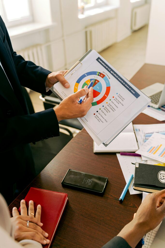 Business professionals discussing financial charts during a strategy meeting.